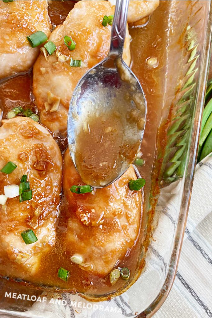 spoon sauce over baked chicken breasts