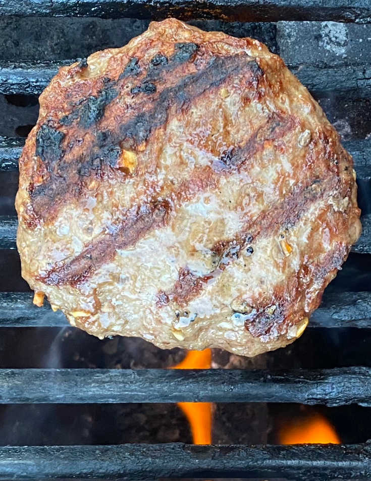 cooking hamburger on a gas grill