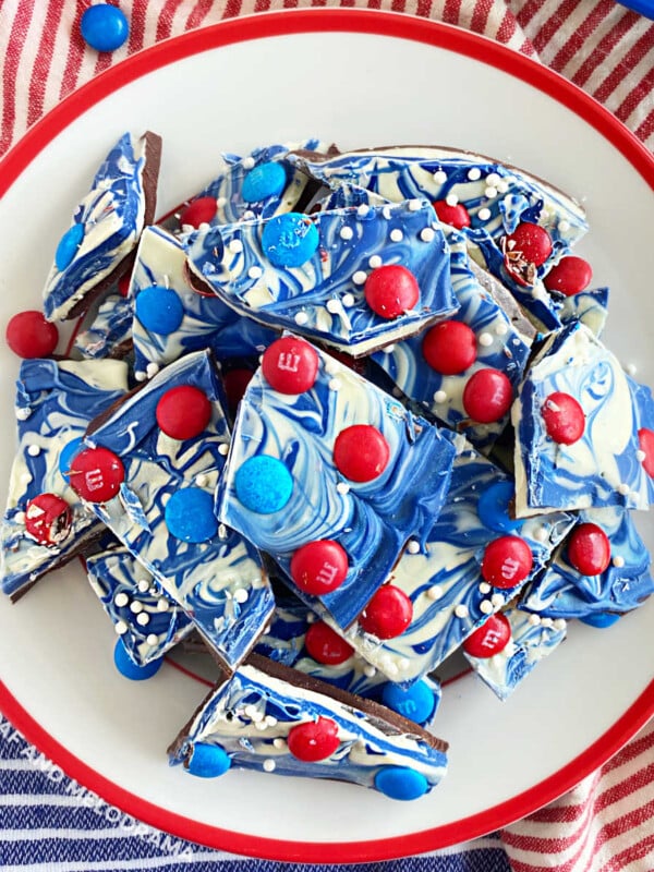 overhead pic of red white and blue bark with m and m candy on plate