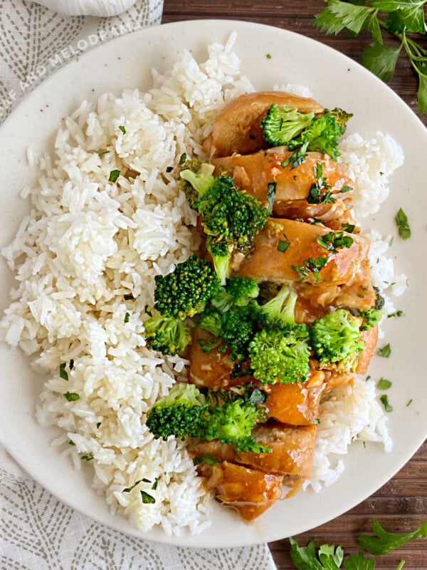 instant pot honey garlic chicken and broccoli on white plate with rice