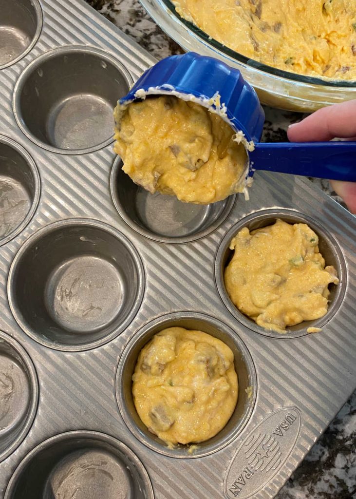 spoon cornbread batter into muffin tin