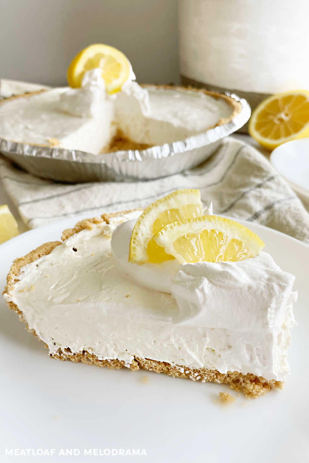 kool aid pie with lemon slices and graham cracker crust on a plate