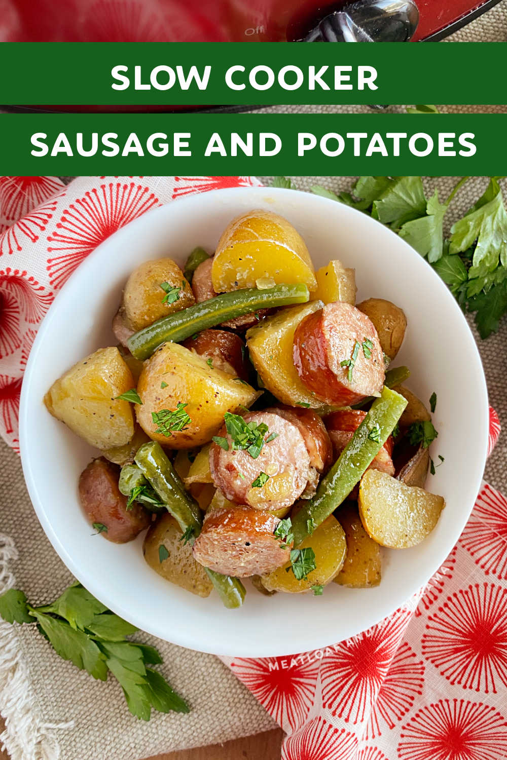 This Slow Cooker Sausage and Potatoes recipe is an easy dinner made in the crock pot with kielbasa smoked sausage, baby potatoes and green beans. Your whole family will love this delicious comfort food made with just a few simple ingredients! via @meamel