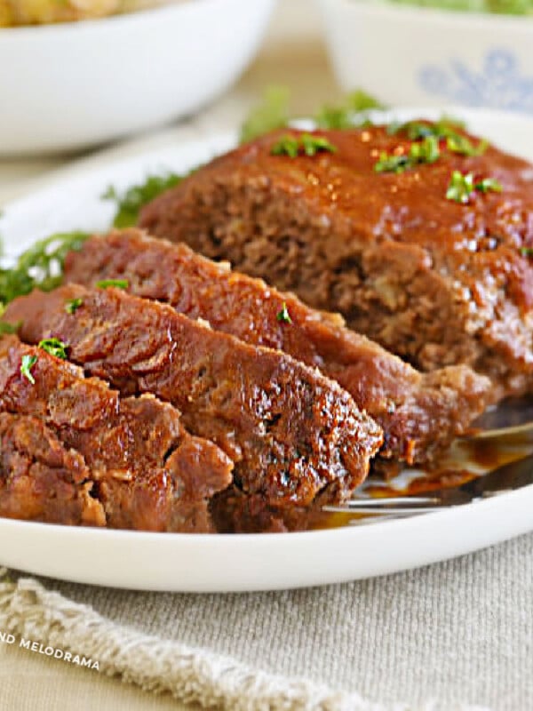 meatloaf with tomato sauce and brown sugar glaze on white platter