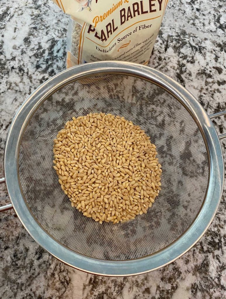 pearl barley in mesh strainer to rinse before making soup