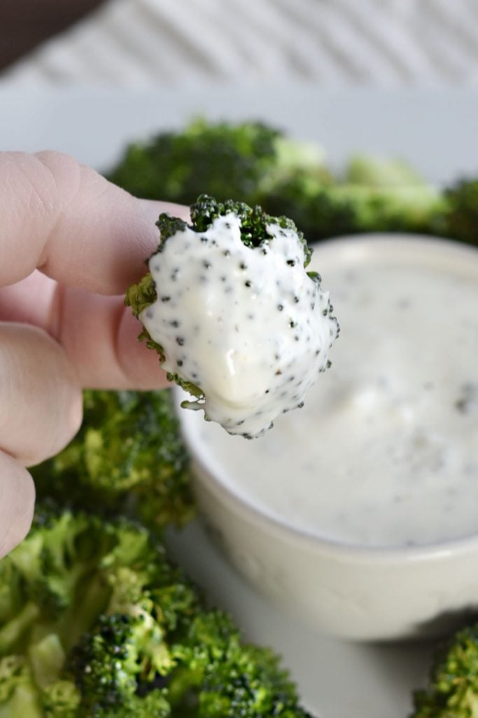 crispy air fryer broccoli dipped in ranch dressing