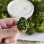 crispy air fryer broccoli in hand