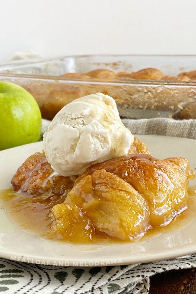 crescent roll apple dumplings topped with vanilla ice cream and caramel sauce