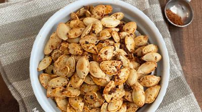 bowl of spicy roasted pumpkin seeds with taco seasoning