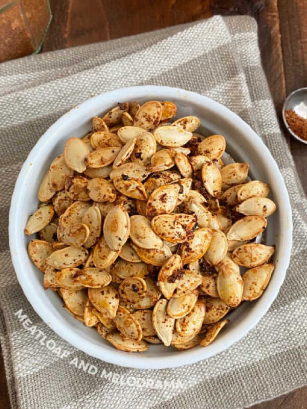 bowl of spicy roasted pumpkin seeds with taco seasoning