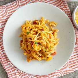 instant pot chicken spaghetti on a plate topped with parsley