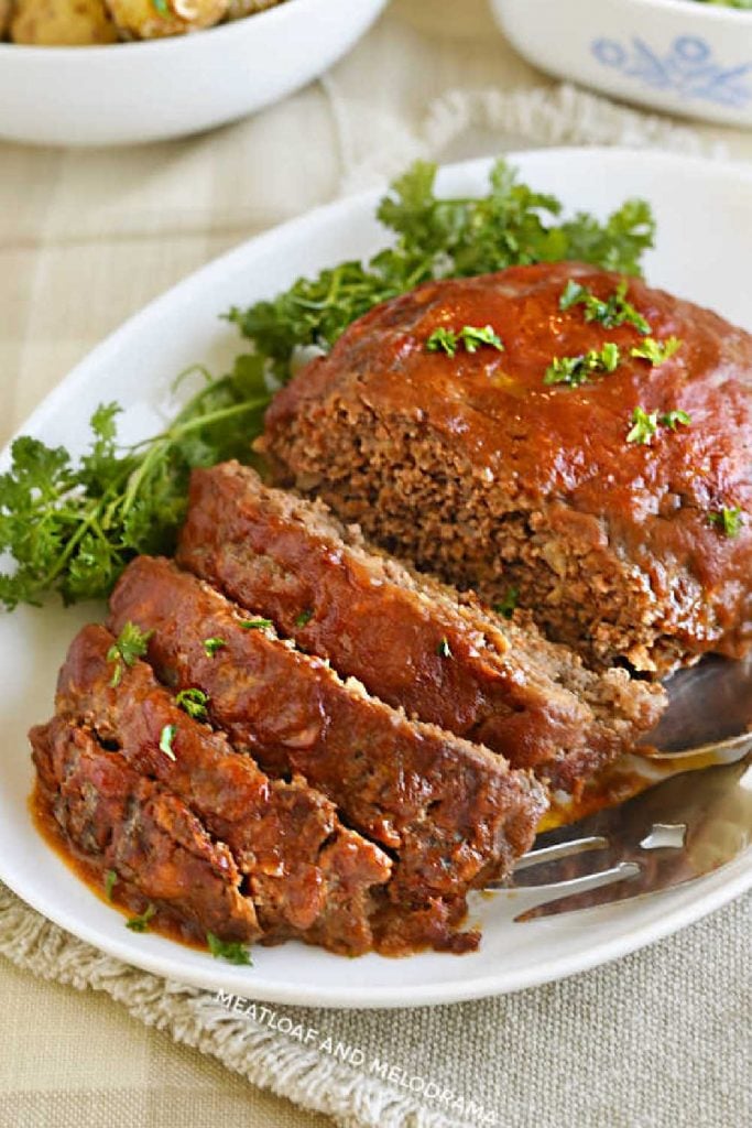 meatloaf with tomato sauce sliced on platter