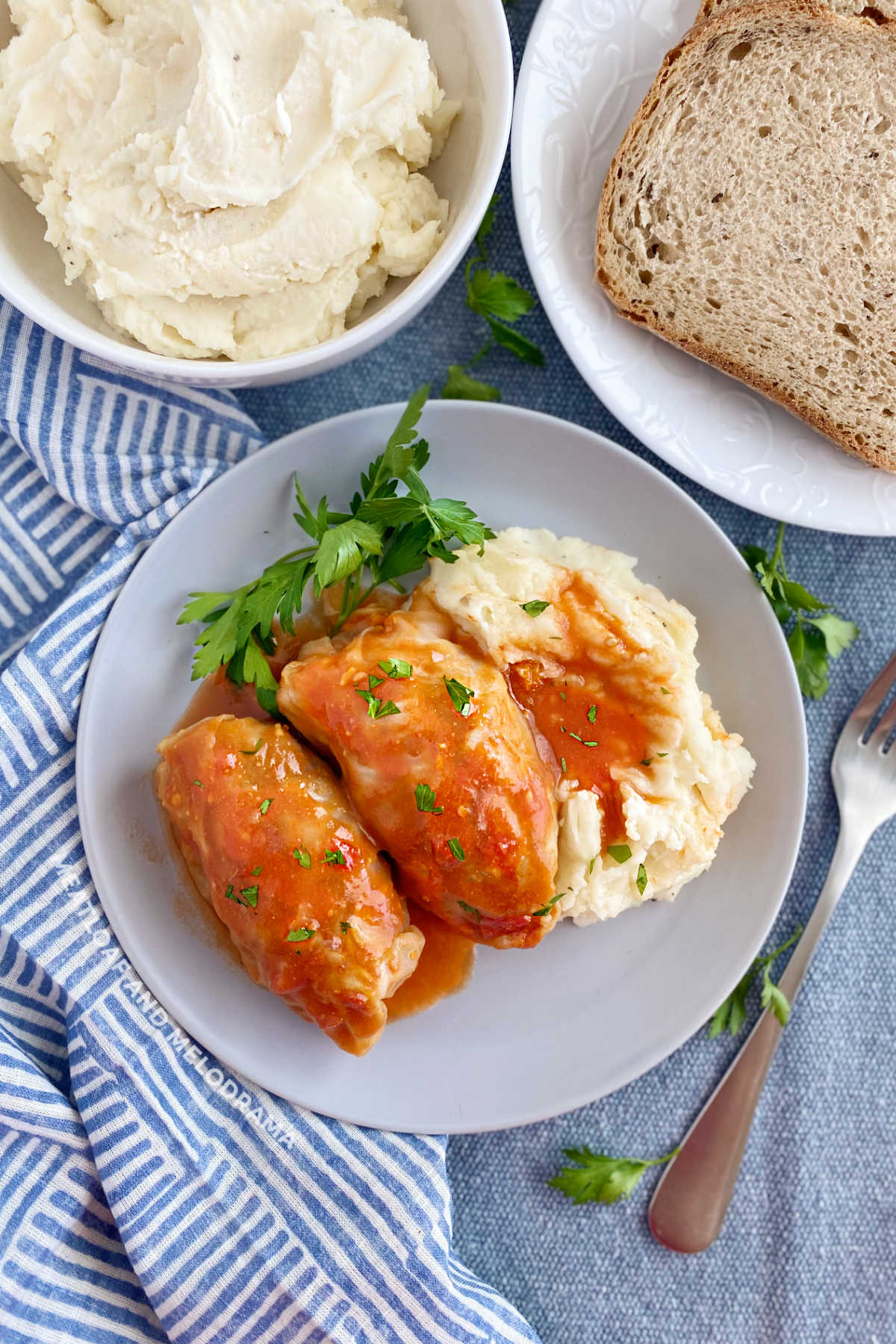 Grandma's cabbage rolls in tomato soup sauce with mashed potatoes and rye bread on the table