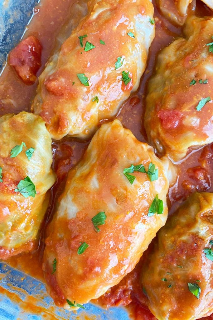 baked stuffed cabbage rolls in tomato sauce in pan