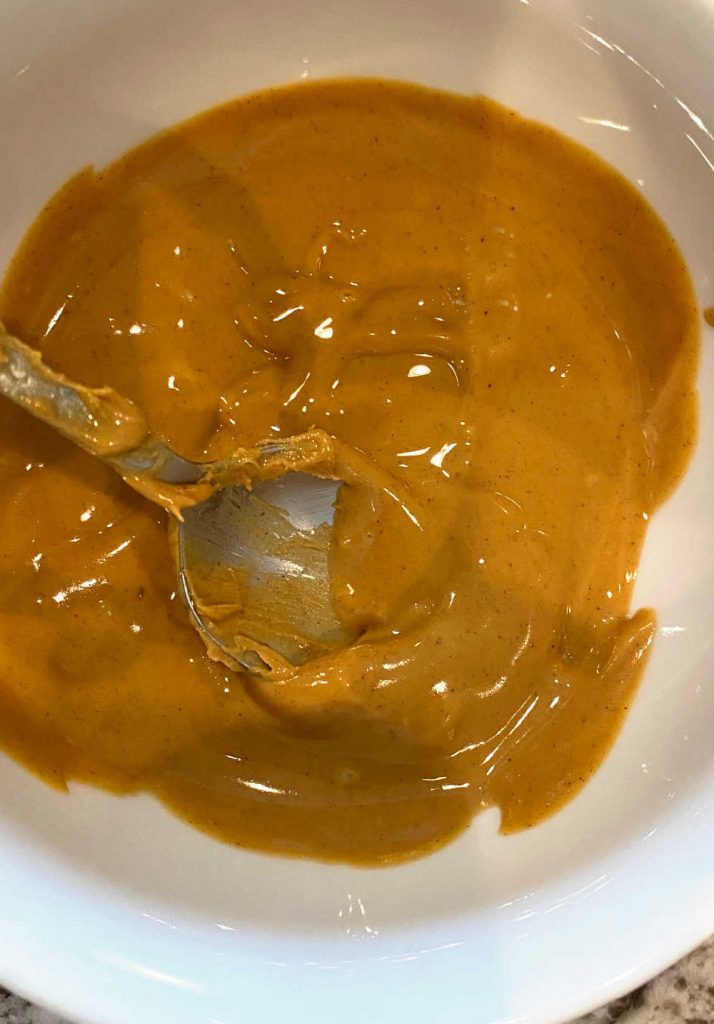 stir melted peanut butter with spoon