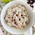 bowl of cranberry chicken salad with apples and dried cranberries with healthy yogurt and mayo dressing
