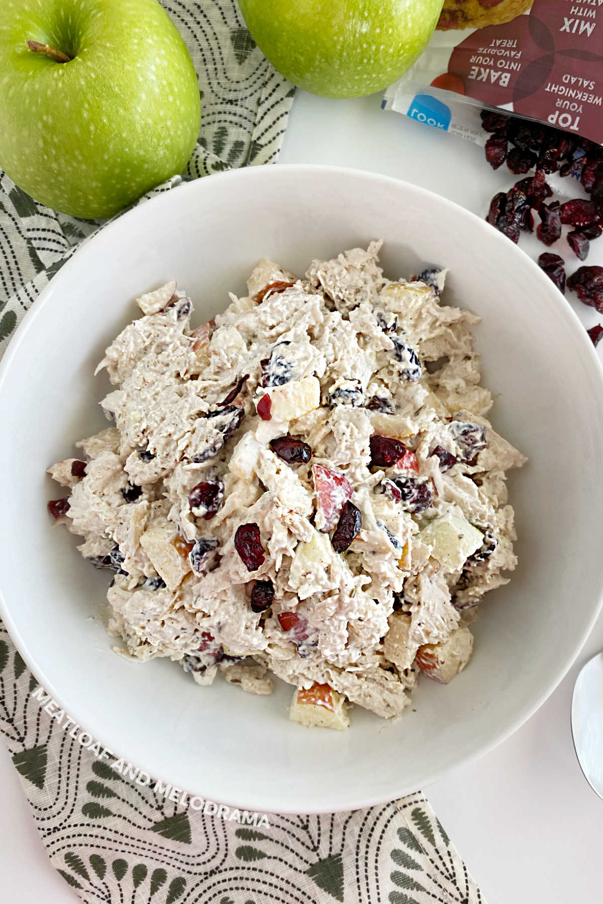 healthy cranberry chicken salad with apples in a white bowl