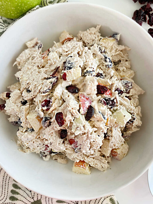 bowl of cranberry chicken salad with apples and dried cranberries with healthy yogurt and mayo dressing