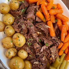 instant pot pot roast with onion soup mix carrots and potatoes on a platter