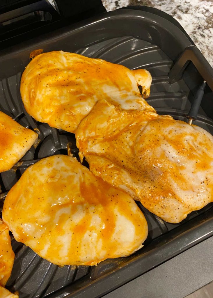 chicken breasts in buffalo sauce on ninja foodi grill