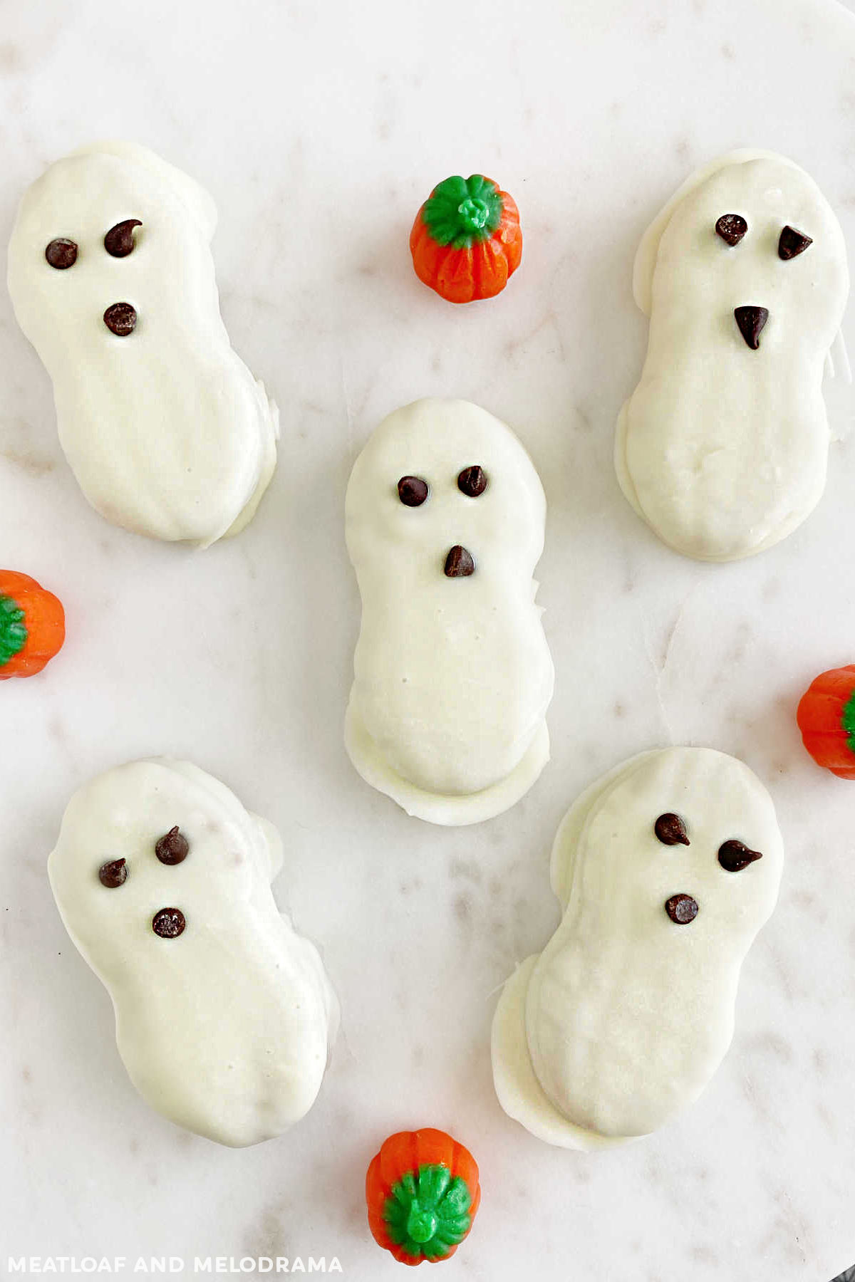 nutter butter halloween ghost cookies with mini chocolate chip eyes