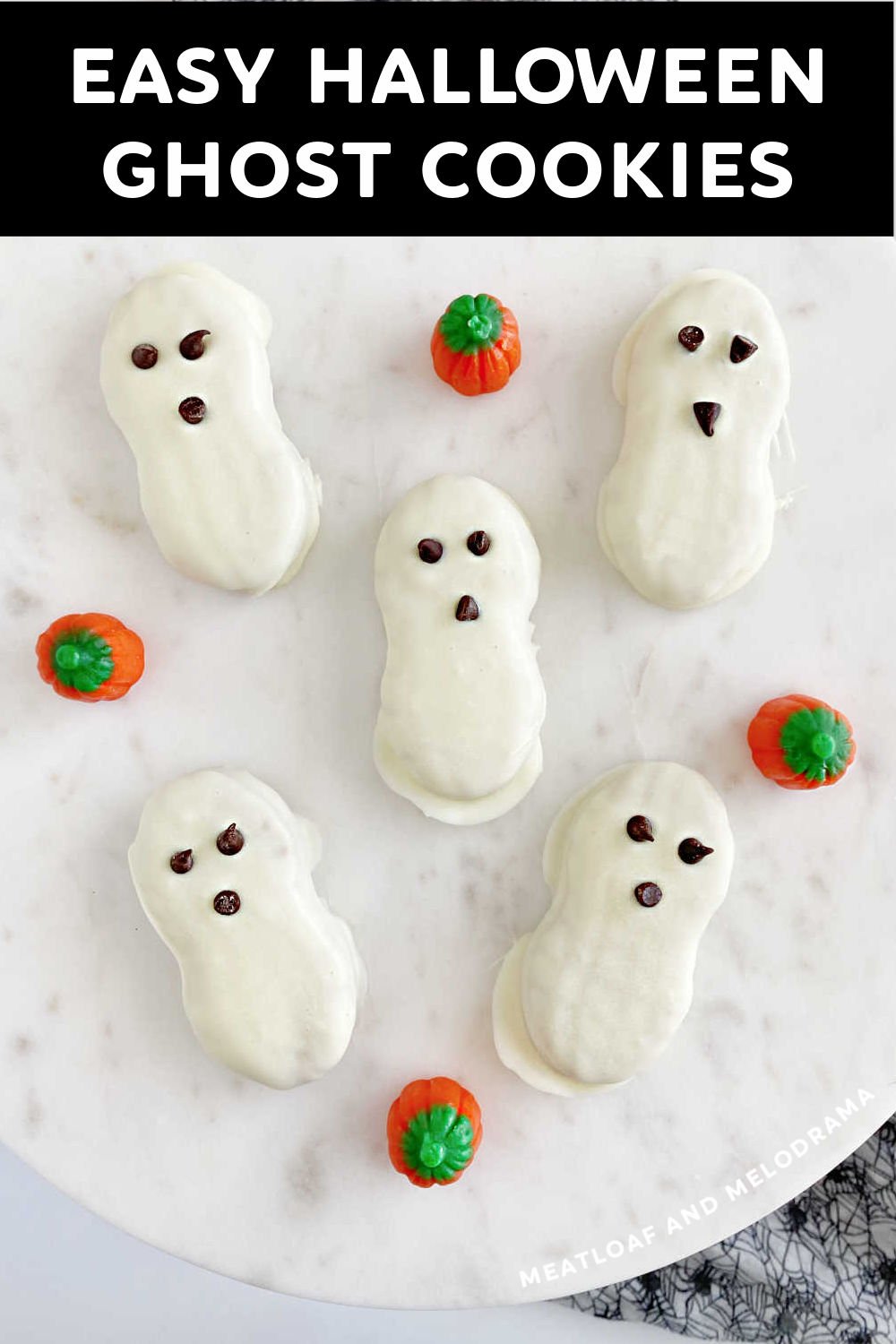 Nutter Butter Halloween Ghost Cookies made with 3 ingredients are super cute Halloween treats. Perfect Halloween party food even kids can make and fun for the whole family! via @meamel