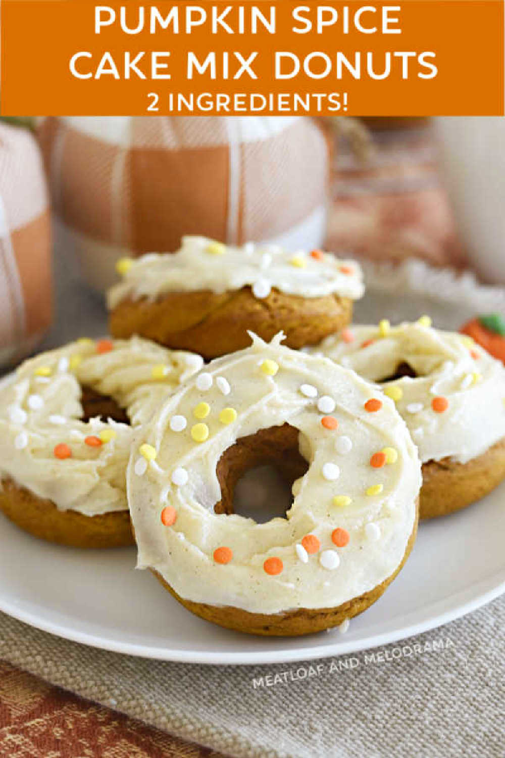 2 ingredient Pumpkin Spice Cake Mix Donuts are made with spice cake mix and pumpkin puree and topped with a delicious cream cheese frosting. This easy baked donuts recipe is perfect for fall!  via @meamel