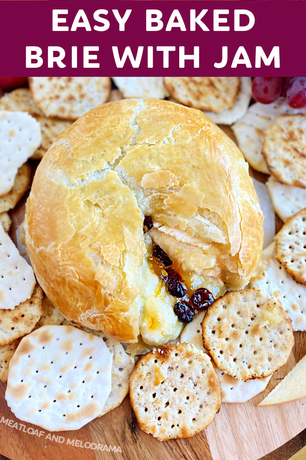 Baked Brie with Jam in puff pastry (Brie en croute) is an easy appetizer recipe with brie cheese, orange marmalade and dried cranberries wrapped in puff pastry dough and baked until the pastry is golden and flaky and the cheese is melted. Perfect for the holiday season! via @meamel
