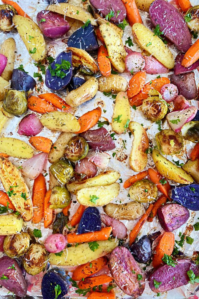 roasted carrots, fingerling potatoes, radishes and brussels sprouts on sheet pan