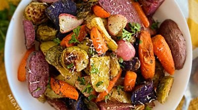 bowl of roasted vegetables on Thanksgiving table