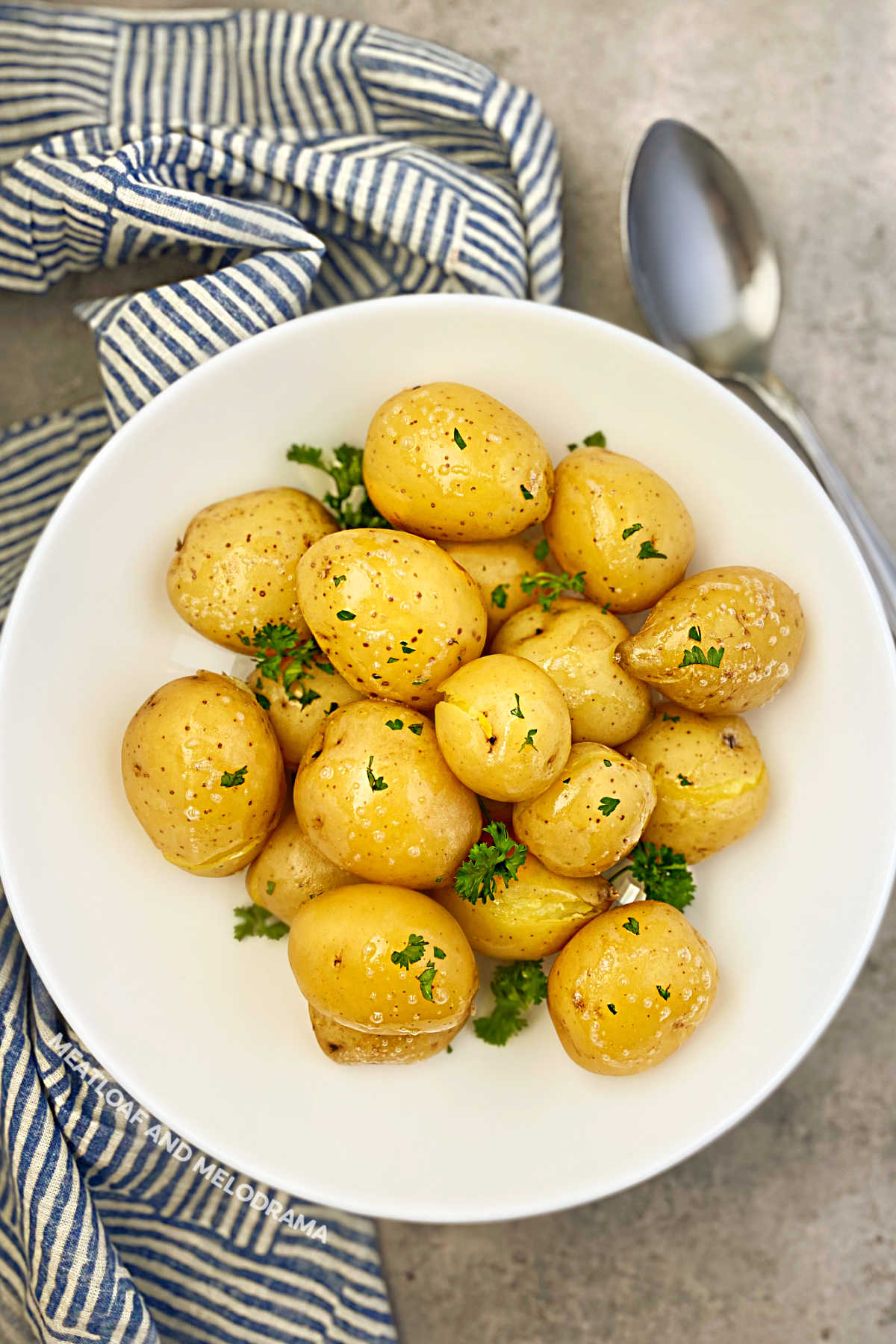 bowl of steamed baby yellow potatoes with parsley