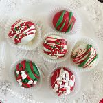 Christmas oreo cake balls on a white platter