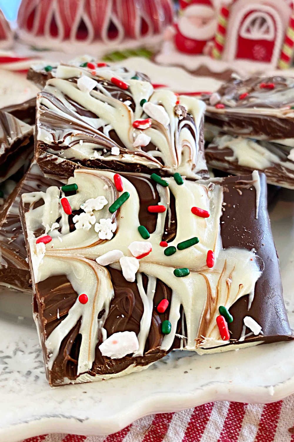 peppermint bark recipe made with swirled white chocolate and semisweet chocolate and peppermint candies on the table