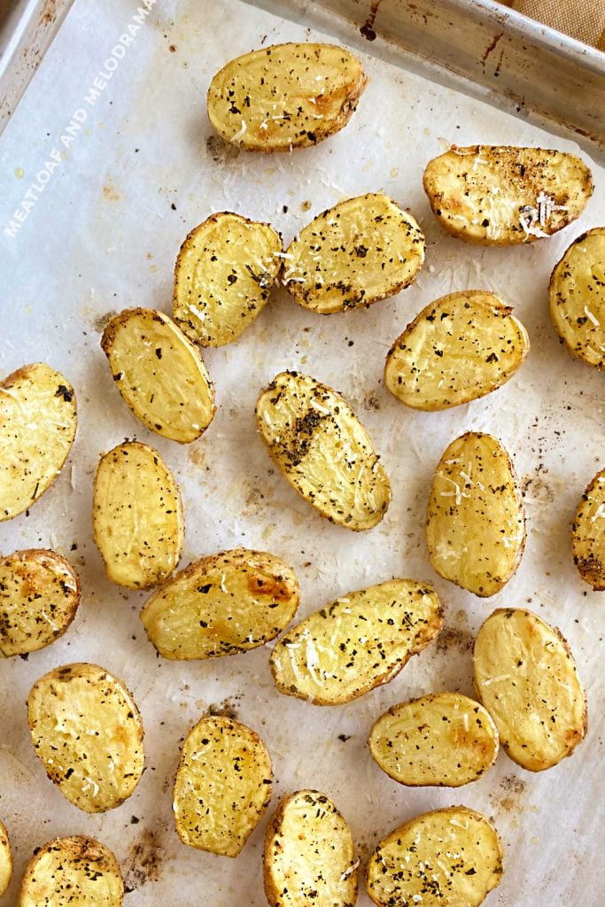 roasted baby dutch potatoes with Parmesan cheese on baking sheet