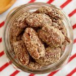 candied pecans coated in cinnamon sugar mixture in mason jar
