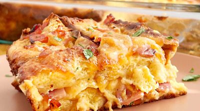 sliced ham and cheese strata on plate