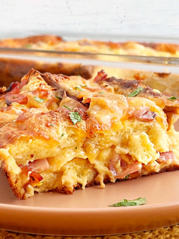 sliced ham and cheese strata on plate