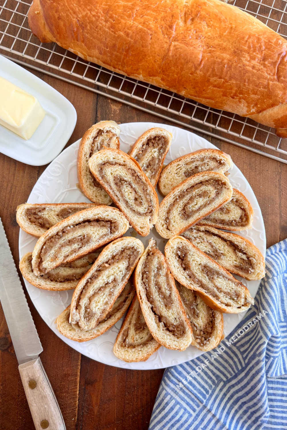 Pittsburgh style Slovak nut roll slices on a platter with loaf in background