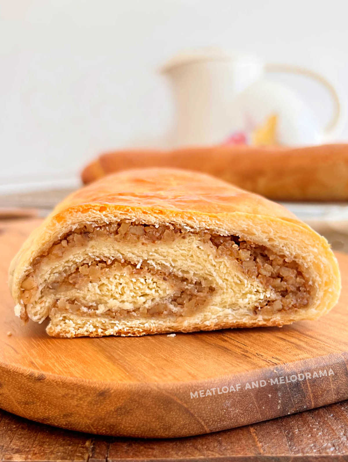 cut nut roll with swirled walnut filling on the table