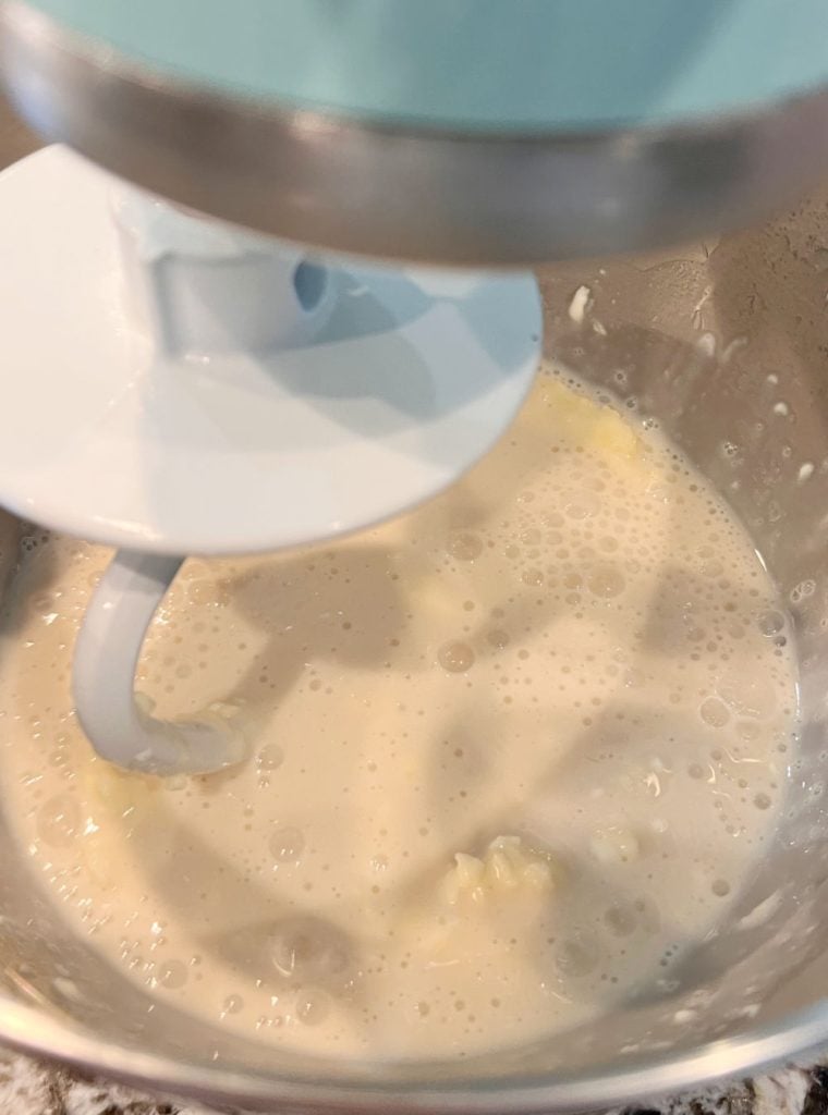 yeast, butter, milk and sugar in stand mixer