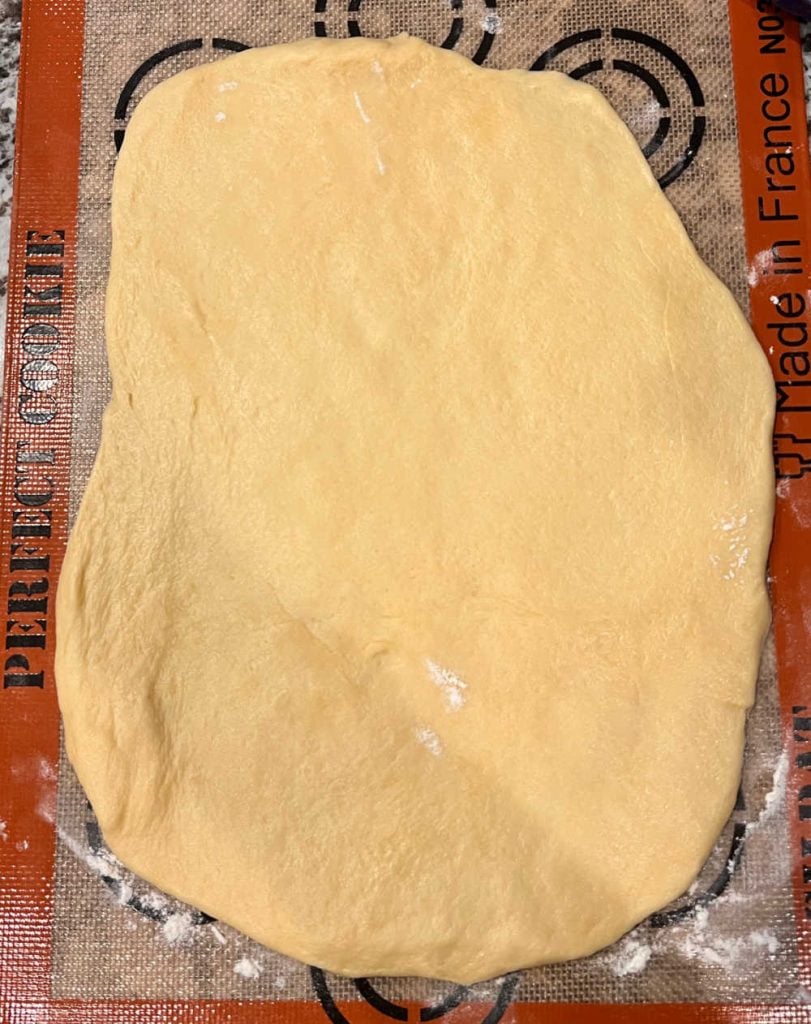 dough rolled 12 x 10 and ¼ inch thick on silicone mat