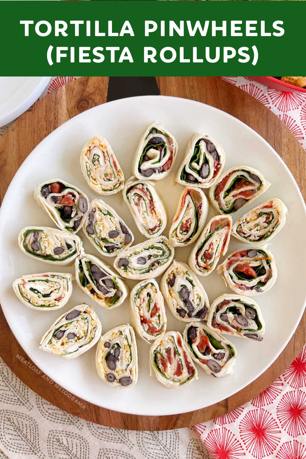 Tortilla Pinwheels (fiesta rollups) are easy appetizers made with tortillas filled with cream cheese, spinach, diced tomatoes and black beans. This delicious appetizer is perfect party food for holidays and game day and makes a healthy light lunch or after school snack!  via @meamel