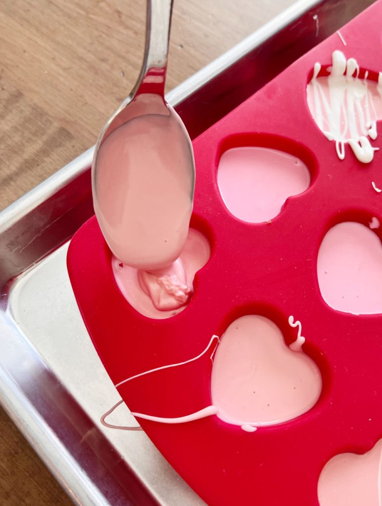 pour melted candy melts into heart shaped mould