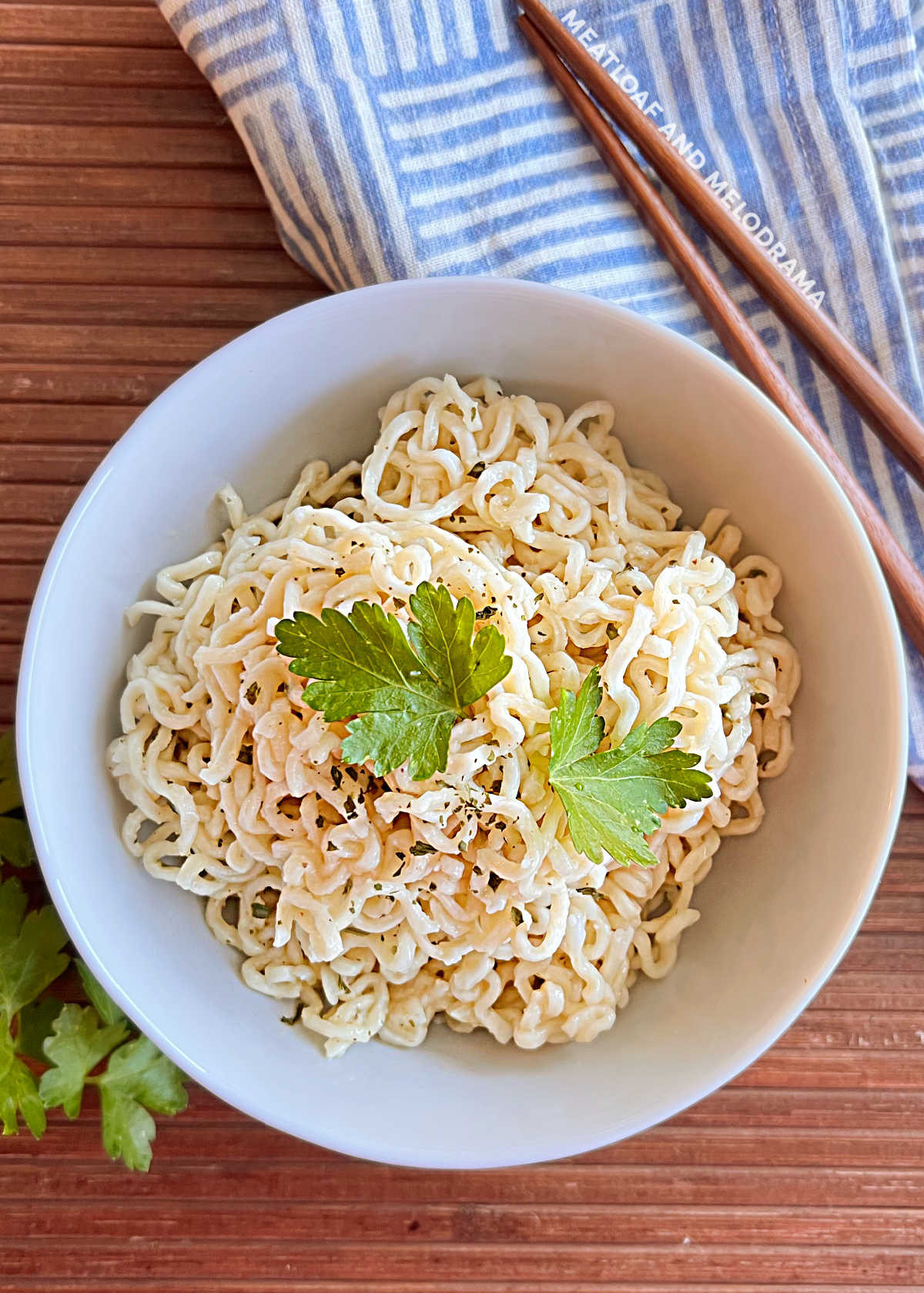 ramen noodles with parsley in a small bowl