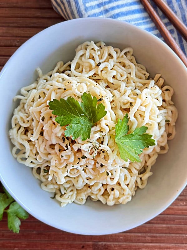 bowl of ramen noodles cooked in microwave with chopsticks