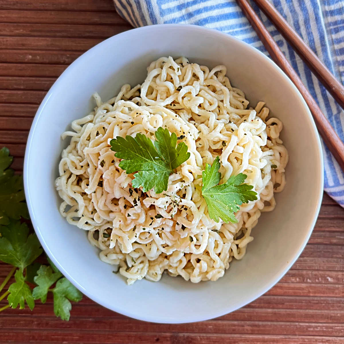 bowl of ramen noodles cooked in microwave with chopsticks