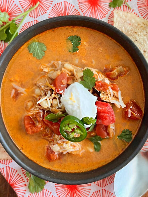 bowl of instant pot chicken enchilada soup on the table
