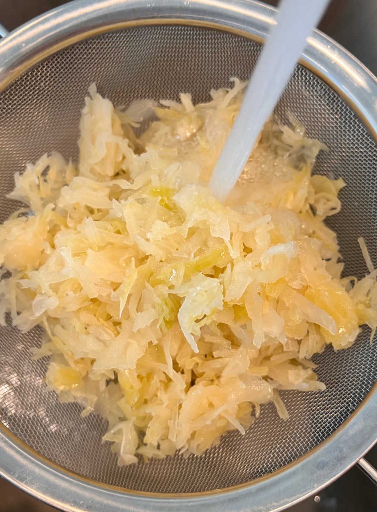 rinse sauerkraut in mesh strainer