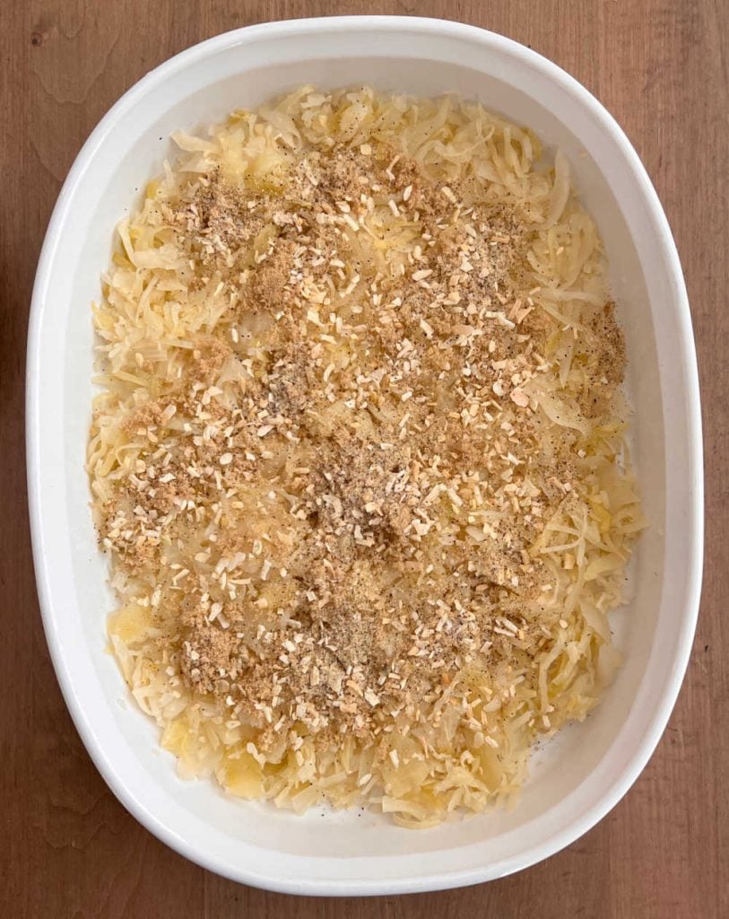 sauerkraut and spices with brown sugar in baking dish