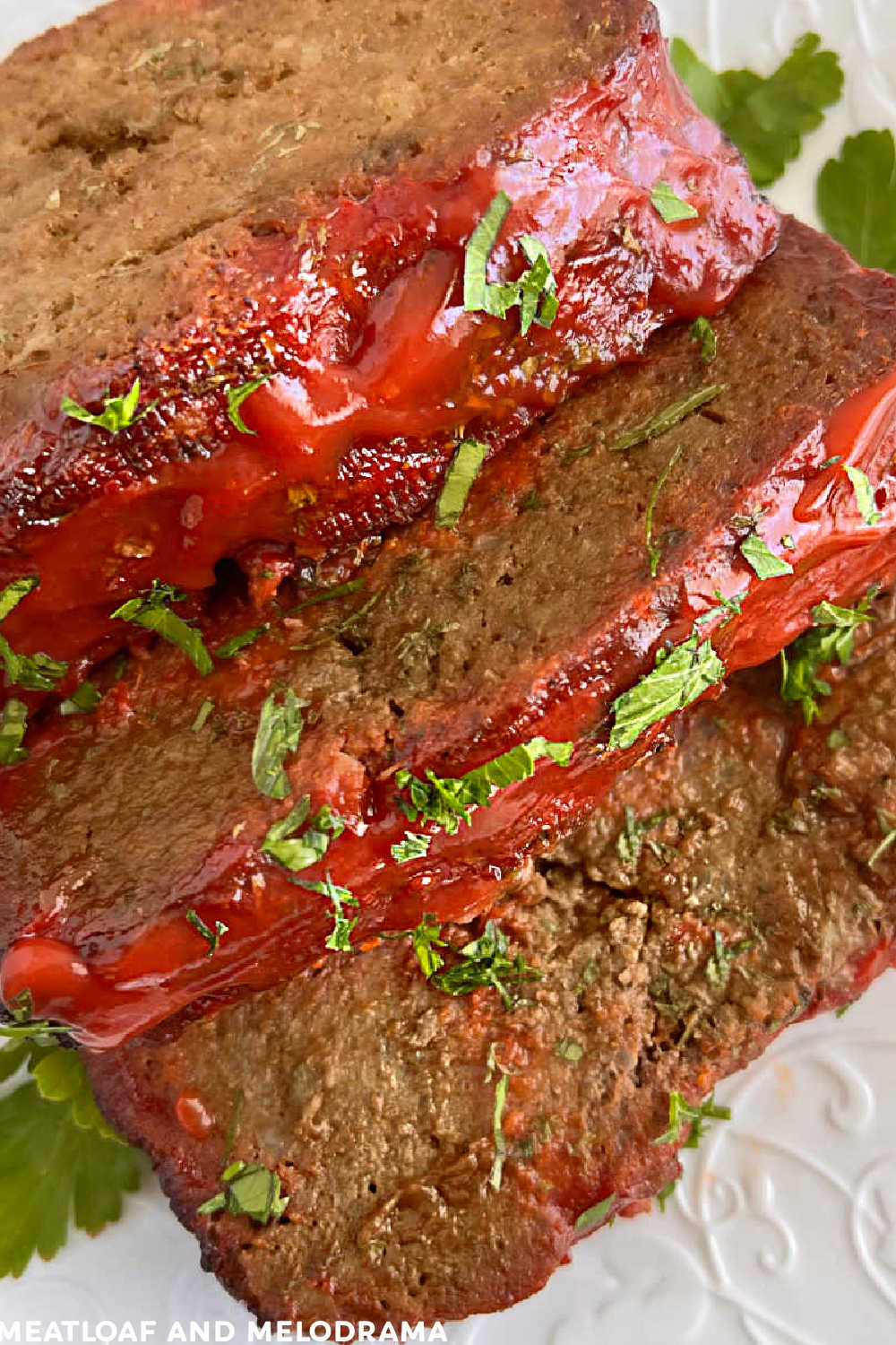 slices of mom's lipton onion soup meatloaf  with ketchup glaze and parsley on plate